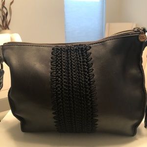 The Sak leather Black med. handbag. Zipper top Adjustable strap. New with tags